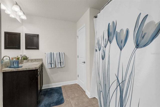 10197 Meadow Wren Ave, Weeki Wachee, FL 34613 - full bath featuring vanity, tile patterned floors, and baseboards