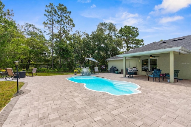 10197 Meadow Wren Ave, Weeki Wachee, FL 34613 - outdoor pool featuring ceiling fan, a patio, and a grill