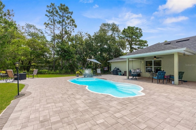 10197 Meadow Wren Ave, Weeki Wachee, FL 34613 - outdoor pool with a ceiling fan, a patio area, and a grill