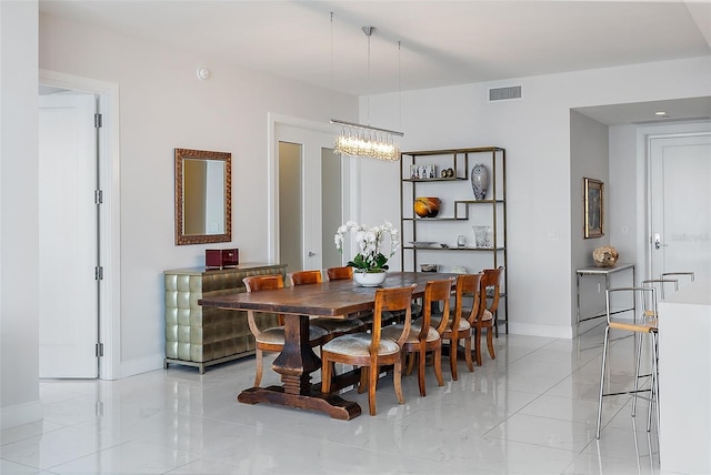 100 1st Ave N Unit 2703, Saint Petersburg, FL 33701 - dining space with a chandelier and baseboards