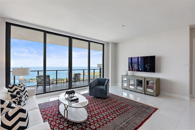 100 1st Ave N Unit 2703, Saint Petersburg, FL 33701 - living room with a wall of windows, marble look tiles, and baseboards