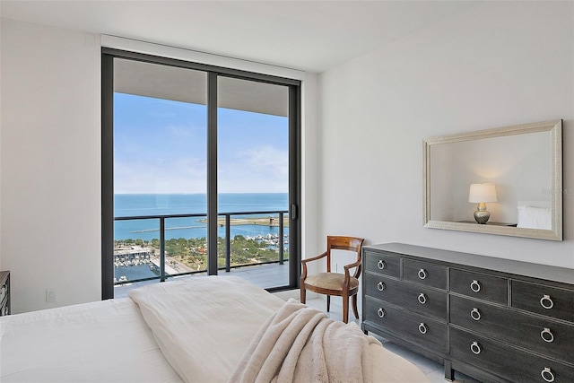 100 1st Ave N Unit 2703, Saint Petersburg, FL 33701 - bedroom featuring a water view, access to exterior, and expansive windows