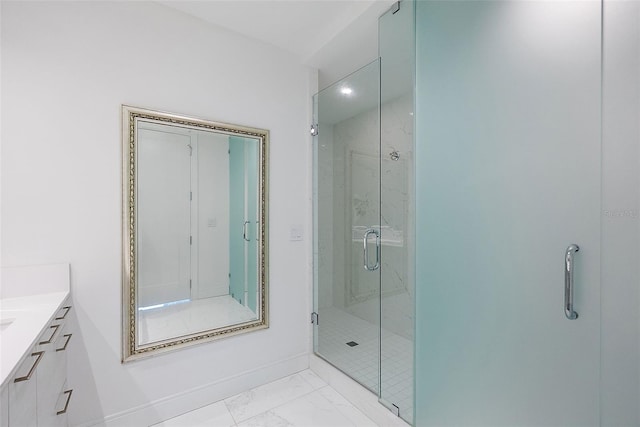 100 1st Ave N Unit 2703, Saint Petersburg, FL 33701 - bathroom with marble look tiles, a marble finish shower, vanity, and baseboards