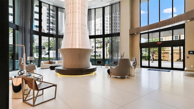 100 1st Ave N Unit 2703, Saint Petersburg, FL 33701 - common area with a high ceiling and expansive windows