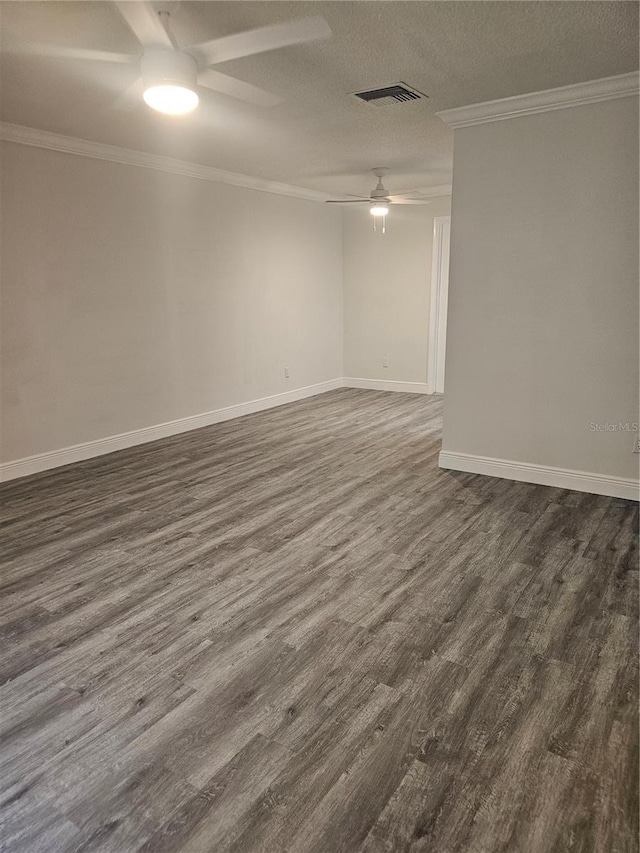 1107 Queen Anne Dr Unit C, Palm Harbor, FL 34684 - unfurnished room featuring ceiling fan, dark wood finished floors, ornamental molding, baseboards, and a textured ceiling