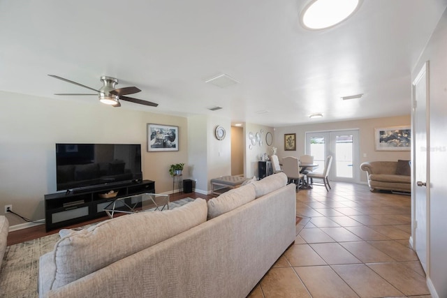 1706 Sloop Pl, Brandon, FL 33511 - living room featuring a ceiling fan, baseboards, and light tile patterned floors