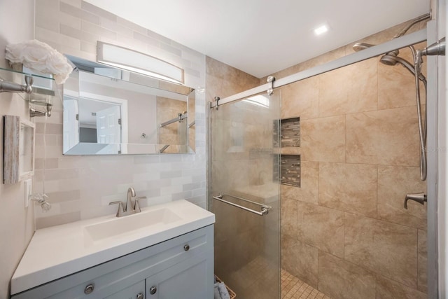 1706 Sloop Pl, Brandon, FL 33511 - bathroom featuring a shower stall, vanity, tasteful backsplash, and tile walls