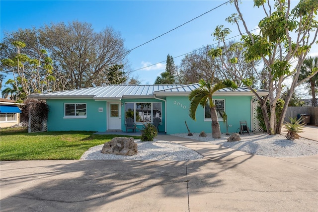 2010 Bayview Pl, Indian Rocks Beach, FL 33785 - ranch-style house with a standing seam roof, stucco siding, and metal roof