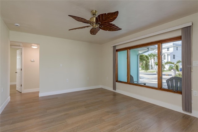 2010 Bayview Pl, Indian Rocks Beach, FL 33785 - unfurnished room featuring light wood-style flooring, a ceiling fan, baseboards, and a smoke detector