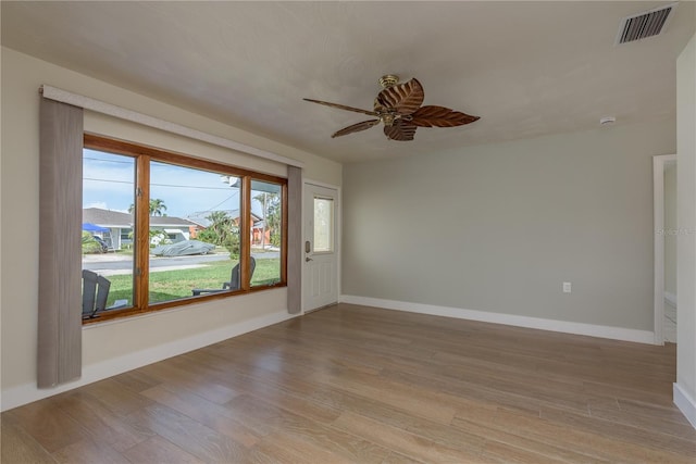 2010 Bayview Pl, Indian Rocks Beach, FL 33785 - empty room with ceiling fan, light wood-type flooring, and baseboards