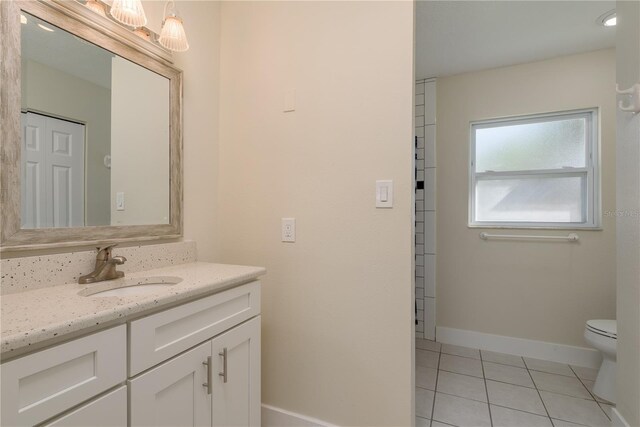 2010 Bayview Pl, Indian Rocks Beach, FL 33785 - bathroom with vanity, tile patterned flooring, toilet, and baseboards