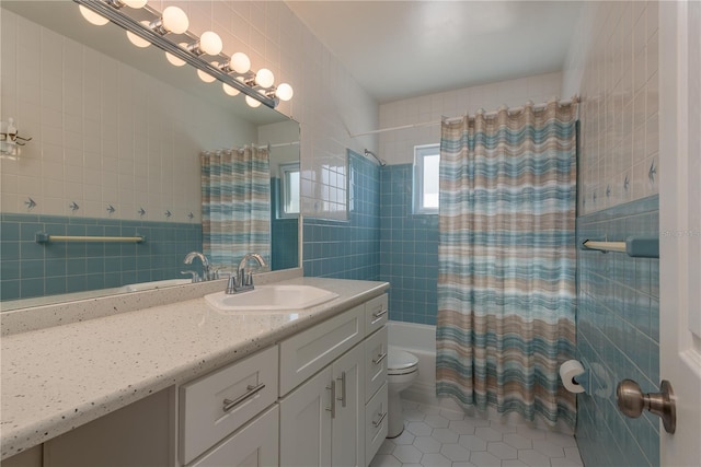 2010 Bayview Pl, Indian Rocks Beach, FL 33785 - bathroom featuring vanity, tile patterned floors, shower / tub combo, toilet, and tile walls