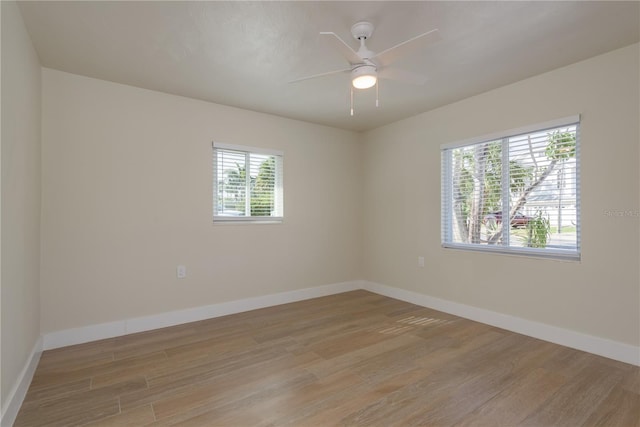 2010 Bayview Pl, Indian Rocks Beach, FL 33785 - unfurnished room with light wood-style flooring, baseboards, and a ceiling fan