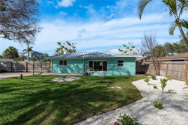 2010 Bayview Pl, Indian Rocks Beach, FL 33785 - back of house with a patio area, a standing seam roof, metal roof, and stucco siding