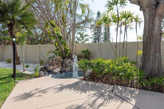2010 Bayview Pl, Indian Rocks Beach, FL 33785 - fenced backyard with a patio area