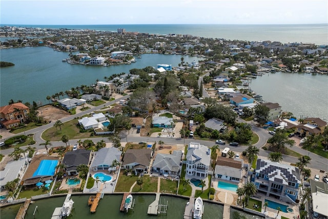 2010 Bayview Pl, Indian Rocks Beach, FL 33785 - aerial view of property and surrounding area featuring a large body of water, nearby suburban area, and a pool