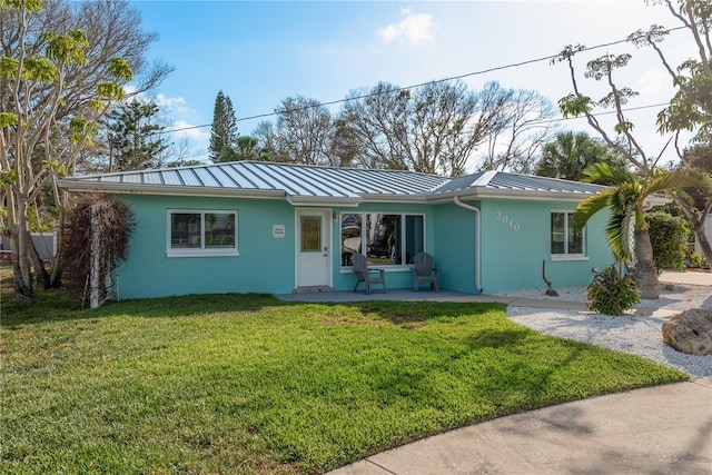 2010 Bayview Pl, Indian Rocks Beach, FL 33785 - ranch-style house featuring a standing seam roof, stucco siding, metal roof, and a front yard