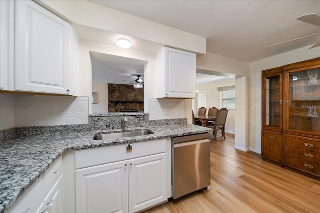 6282 41st Ave N, Saint Petersburg, FL 33709 - kitchen with dishwasher, a ceiling fan, a sink, tasteful backsplash, and light wood-style flooring