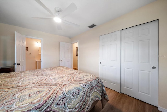 6282 41st Ave N, Saint Petersburg, FL 33709 - bedroom featuring wood finished floors, a closet, a ceiling fan, and ensuite bathroom