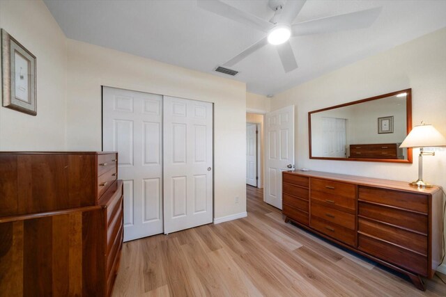 6282 41st Ave N, Saint Petersburg, FL 33709 - bedroom with light wood-style flooring, a closet, baseboards, and ceiling fan