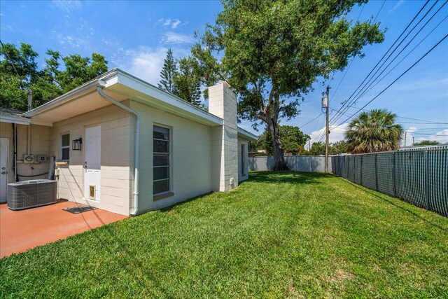 6282 41st Ave N, Saint Petersburg, FL 33709 - view of yard featuring central AC and a patio