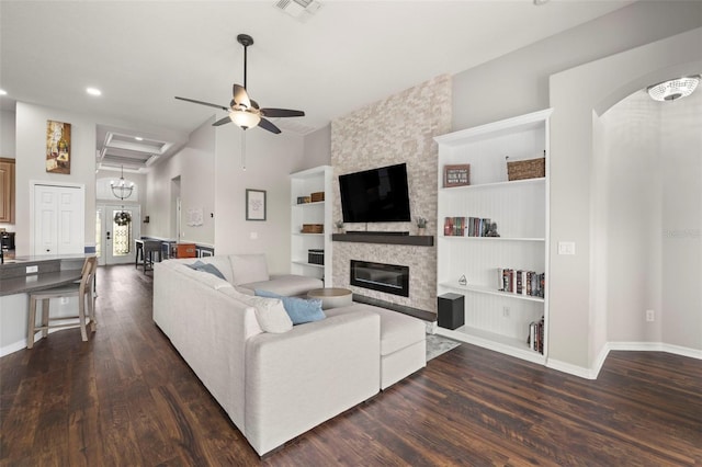 2350 126th Dr E, Parrish, FL 34219 - living area featuring dark wood-style flooring, built in features, a stone fireplace, recessed lighting, and ceiling fan