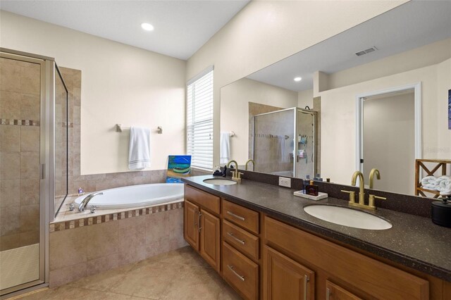 2350 126th Dr E, Parrish, FL 34219 - full bath with a stall shower, double vanity, a garden tub, tile patterned flooring, and recessed lighting