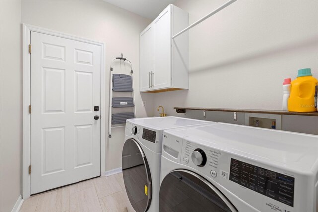 2350 126th Dr E, Parrish, FL 34219 - laundry room featuring cabinet space and independent washer and dryer