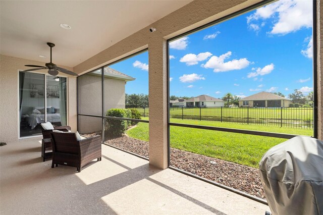 2350 126th Dr E, Parrish, FL 34219 - sunroom featuring ceiling fan and a residential view