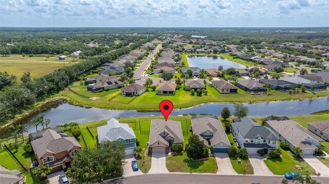 2350 126th Dr E, Parrish, FL 34219 - aerial perspective of suburban area with a large body of water