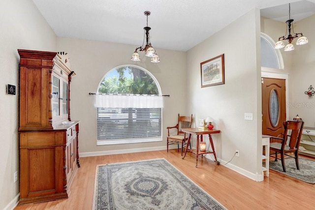 613 Sportsman Park Dr, Seffner, FL 33584 - living area featuring a chandelier, light wood-style flooring, and baseboards