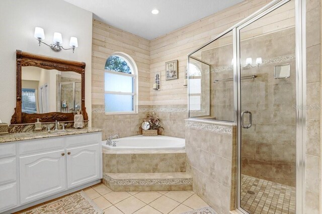 613 Sportsman Park Dr, Seffner, FL 33584 - full bathroom with vanity, a garden tub, tile patterned flooring, and a shower stall