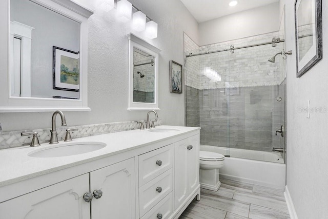 613 Sportsman Park Dr, Seffner, FL 33584 - full bath with toilet, bath / shower combo with glass door, and double vanity