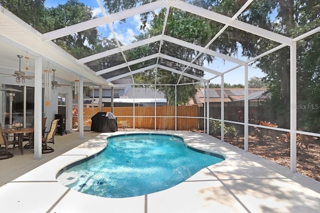 613 Sportsman Park Dr, Seffner, FL 33584 - view of swimming pool featuring a patio, a fenced backyard, a grill, a lanai, and a ceiling fan