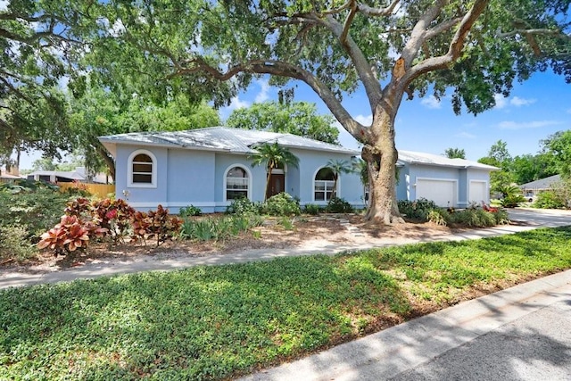 613 Sportsman Park Dr, Seffner, FL 33584 - ranch-style home with a garage, stucco siding, and driveway