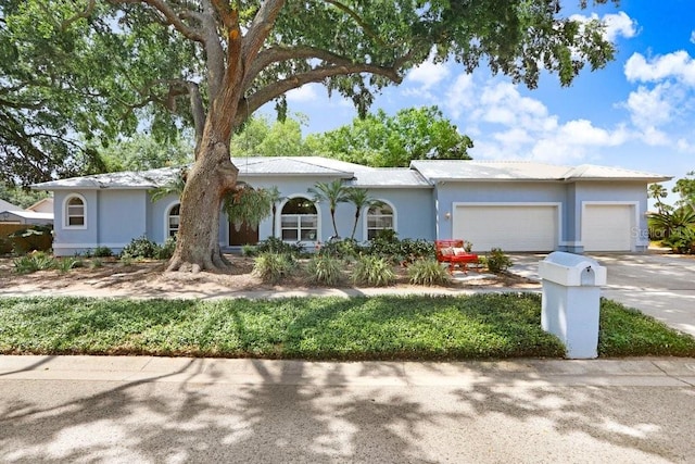 613 Sportsman Park Dr, Seffner, FL 33584 - ranch-style house with a garage, concrete driveway, and stucco siding