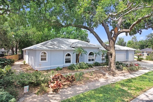 613 Sportsman Park Dr, Seffner, FL 33584 - ranch-style home featuring a garage and stucco siding