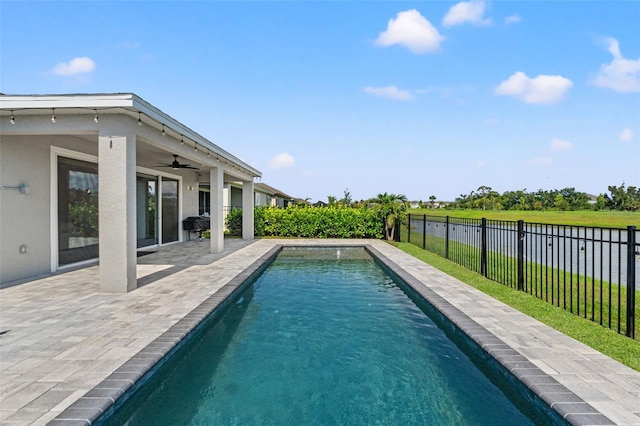 6123 Golden Nettle Dr, Apollo Beach, FL 33572 - view of swimming pool with a ceiling fan, a fenced backyard, and a patio area
