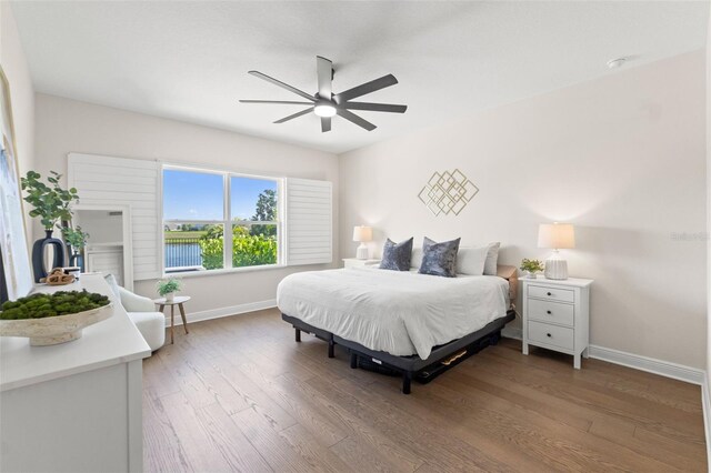 6123 Golden Nettle Dr, Apollo Beach, FL 33572 - bedroom with baseboards, wood finished floors, and a ceiling fan