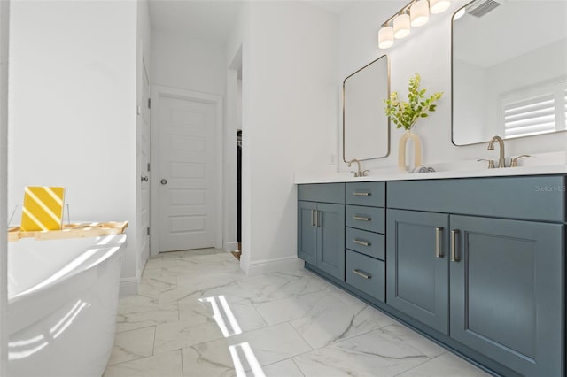 6123 Golden Nettle Dr, Apollo Beach, FL 33572 - full bath with marble finish flooring, double vanity, baseboards, and a soaking tub