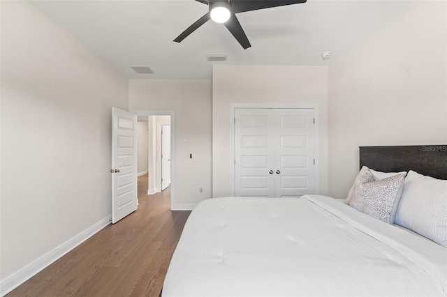 6123 Golden Nettle Dr, Apollo Beach, FL 33572 - bedroom with dark wood-type flooring, baseboards, and ceiling fan