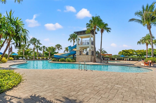 6123 Golden Nettle Dr, Apollo Beach, FL 33572 - community pool featuring a water slide and a patio