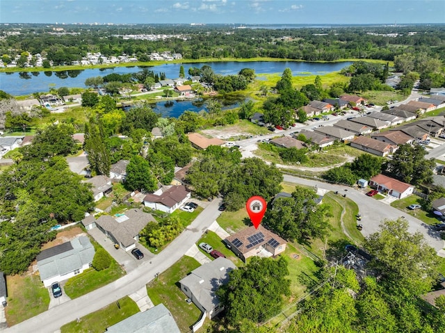 1110 Waterview Blvd E, Lakeland, FL 33801 - aerial view of property and surrounding area featuring nearby suburban area, a large body of water, and a tree filled landscape