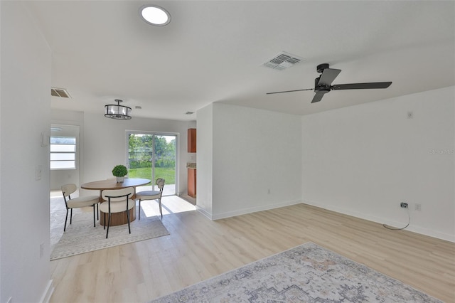 1110 Waterview Blvd E, Lakeland, FL 33801 - dining room with light wood finished floors, a ceiling fan, and baseboards