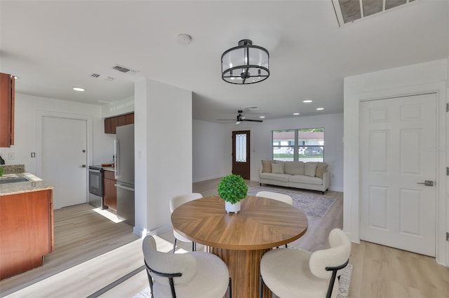 1110 Waterview Blvd E, Lakeland, FL 33801 - dining room featuring light wood-style floors, ceiling fan, a chandelier, recessed lighting, and baseboards
