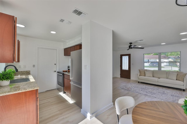 1110 Waterview Blvd E, Lakeland, FL 33801 - kitchen featuring a sink, appliances with stainless steel finishes, light wood-style floors, recessed lighting, and a ceiling fan