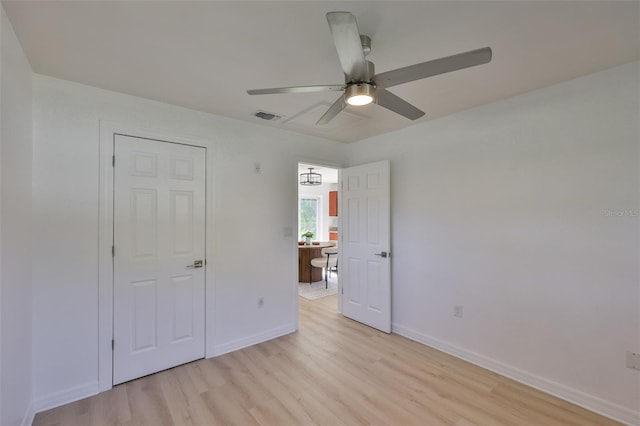 1110 Waterview Blvd E, Lakeland, FL 33801 - unfurnished bedroom featuring light wood-style floors, baseboards, and a ceiling fan