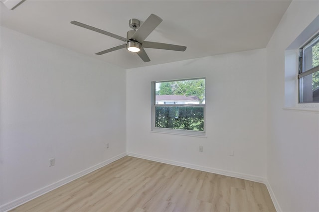 1110 Waterview Blvd E, Lakeland, FL 33801 - unfurnished room with light wood finished floors, a ceiling fan, and baseboards
