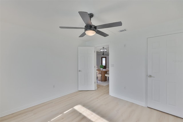 1110 Waterview Blvd E, Lakeland, FL 33801 - unfurnished bedroom with light wood-type flooring, baseboards, and a ceiling fan