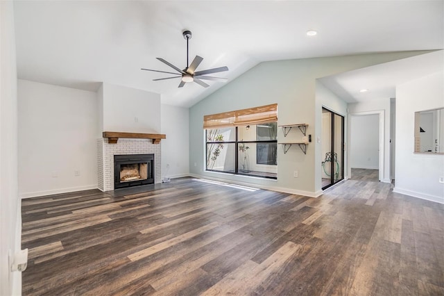 660 Channing Dr, Palm Harbor, FL 34684 - unfurnished living room with wood finished floors, a ceiling fan, lofted ceiling, a fireplace, and baseboards